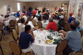 CAPE members and guests eagerly await the Golf Tournament awards results.